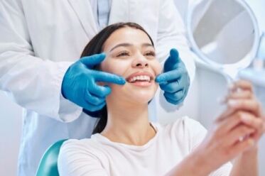 A patient checking the after results of deep cleaning in Scottsdale, AZ.