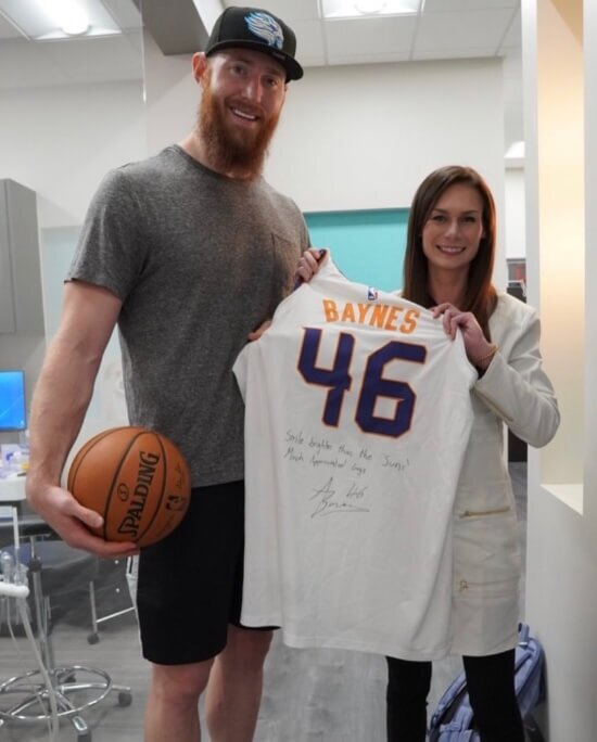 Dentist and football player with a signed jersey in Scottsdale, AZ