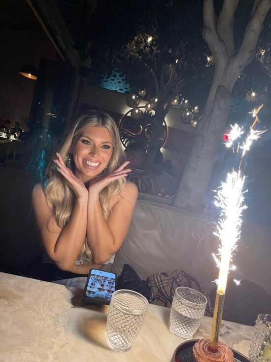 Patient smiling with bright teeth next to sparkler Scottsdale AZ